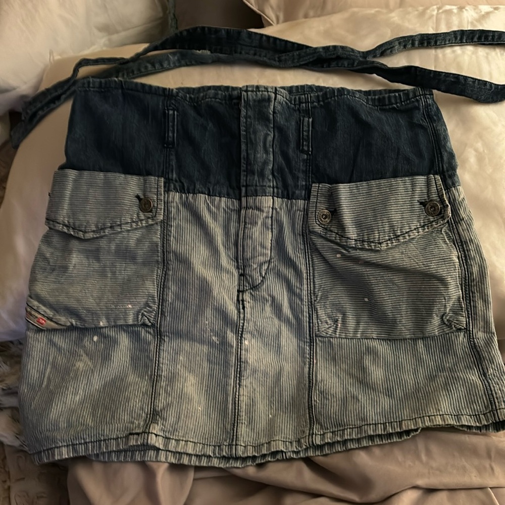 Diesel denim skirt with paint accents.